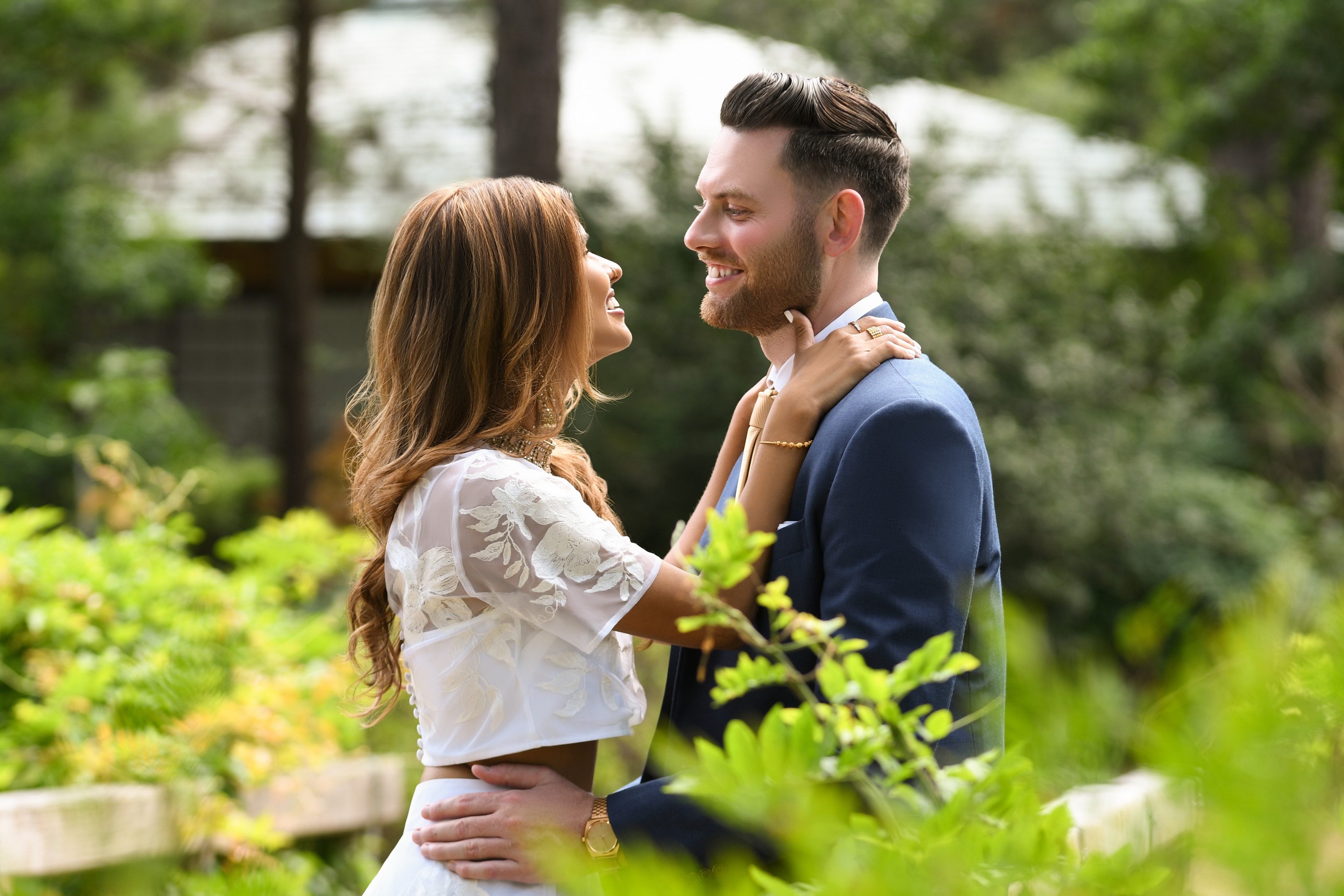 Engaged couple sitting together outdoors